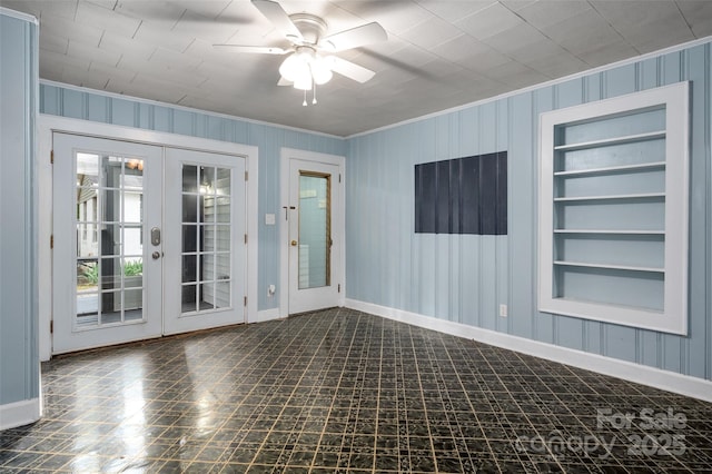 34 Admiral Ave SW, Concord, NC 28027 - spare room featuring crown molding, built in shelves, baseboards, a ceiling fan, and french doors