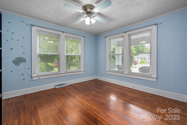34 Admiral Ave SW, Concord, NC 28027 - unfurnished room with a textured ceiling, ornamental molding, baseboards, dark wood-style floors, and ceiling fan
