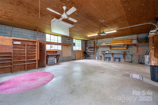 34 Admiral Ave SW, Concord, NC 28027 - garage with concrete block wall and a ceiling fan