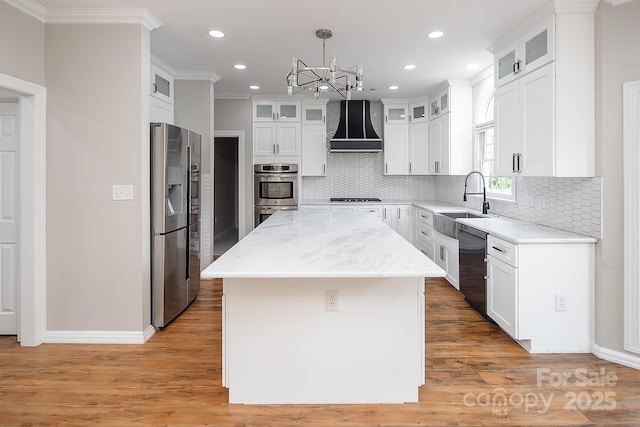 6400 Morningsong Ln, Charlotte, NC 28269 - kitchen featuring stainless steel appliances, custom range hood, a chandelier, crown molding, and recessed lighting