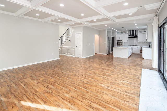 6400 Morningsong Ln, Charlotte, NC 28269 - unfurnished living room with light wood finished floors, coffered ceiling, beamed ceiling, crown molding, and stairway
