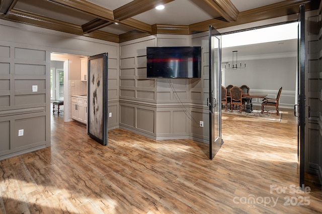 6400 Morningsong Ln, Charlotte, NC 28269 - spare room featuring crown molding, beamed ceiling, light wood-style floors, a decorative wall, and coffered ceiling