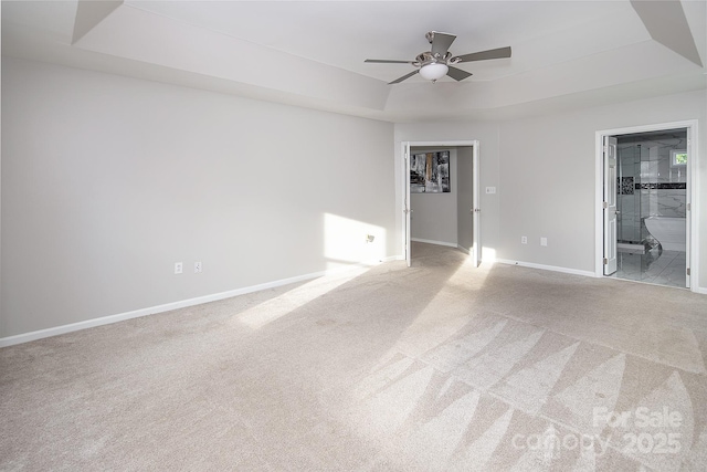 6400 Morningsong Ln, Charlotte, NC 28269 - unfurnished room with a raised ceiling, carpet flooring, and ceiling fan