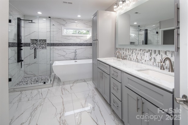 6400 Morningsong Ln, Charlotte, NC 28269 - bathroom with a marble finish shower, a soaking tub, double vanity, and marble tiled flooring