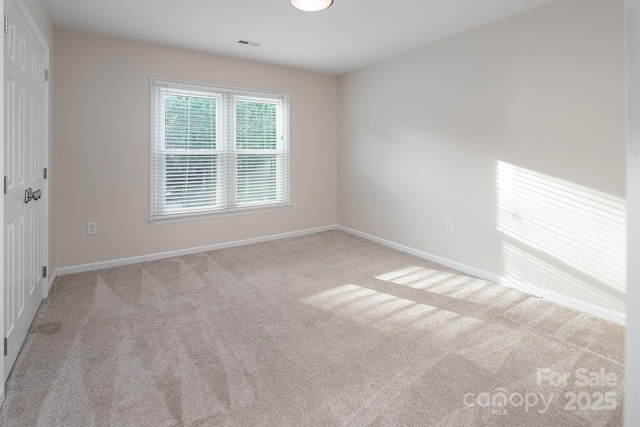 6400 Morningsong Ln, Charlotte, NC 28269 - carpeted spare room featuring baseboards