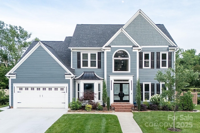 6400 Morningsong Ln, Charlotte, NC 28269 - view of front facade featuring concrete driveway, a front yard, french doors, and a garage