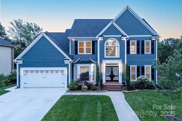 6400 Morningsong Ln, Charlotte, NC 28269 - view of front facade featuring driveway, a front lawn, french doors, an attached garage, and roof with shingles