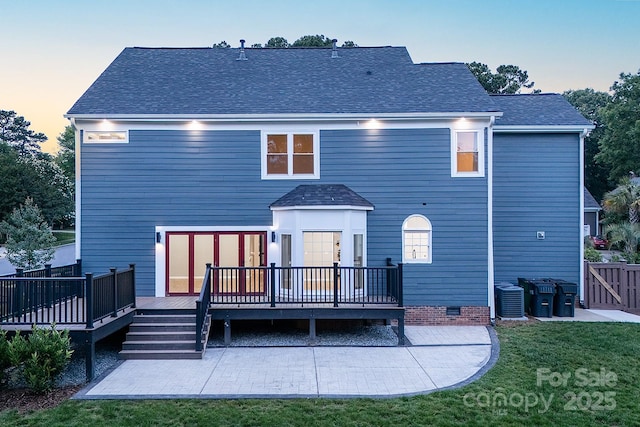 6400 Morningsong Ln, Charlotte, NC 28269 - back of house at dusk featuring a patio area, a deck, roof with shingles, and crawl space
