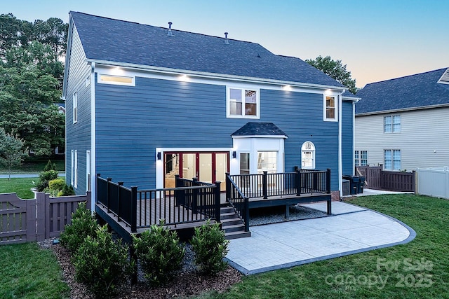 6400 Morningsong Ln, Charlotte, NC 28269 - back of house with a deck, a patio area, and a shingled roof