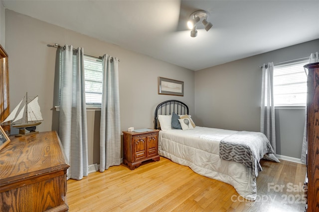 504 Amon Ln, Pineville, NC 28134 - bedroom with light wood-type flooring and baseboards