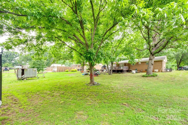 504 Amon Ln, Pineville, NC 28134 - view of yard featuring a deck and an outbuilding
