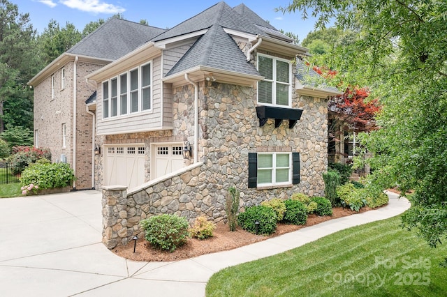 3204 Mcpherson St, Waxhaw, NC 28173 - view of property exterior featuring stone siding, concrete driveway, an attached garage, and a shingled roof