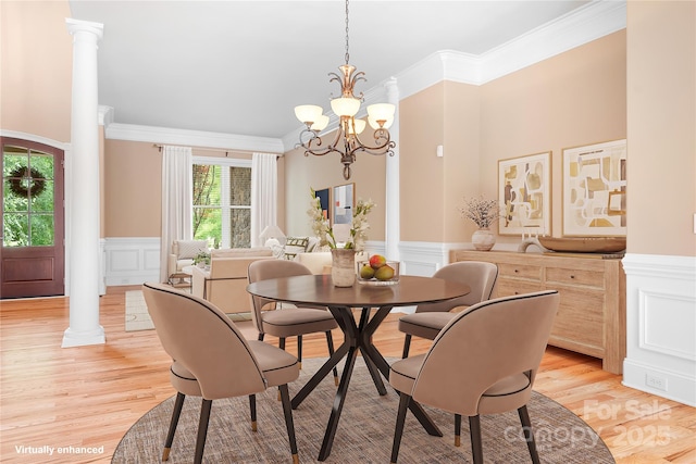 3204 Mcpherson St, Waxhaw, NC 28173 - dining room with ornate columns, a decorative wall, ornamental molding, a wainscoted wall, and a chandelier