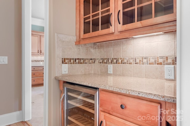 3204 Mcpherson St, Waxhaw, NC 28173 - indoor dry bar featuring wine cooler, tasteful backsplash, crown molding, and baseboards
