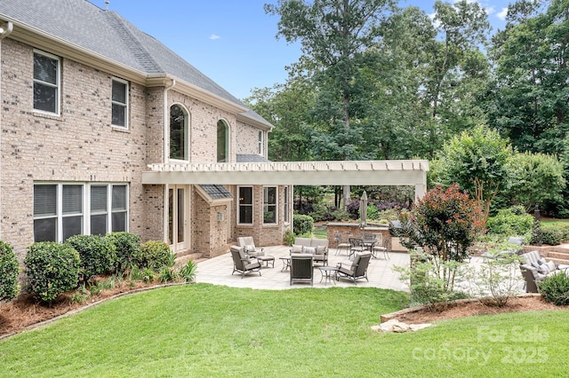 3204 Mcpherson St, Waxhaw, NC 28173 - back of property featuring outdoor lounge area, brick siding, a patio area, and a yard