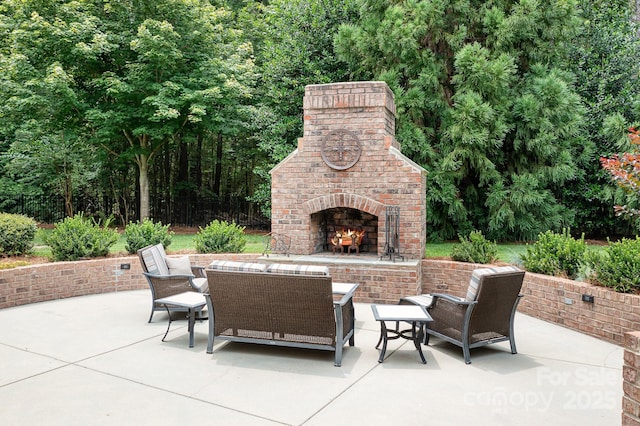 3204 Mcpherson St, Waxhaw, NC 28173 - view of patio with an outdoor brick fireplace