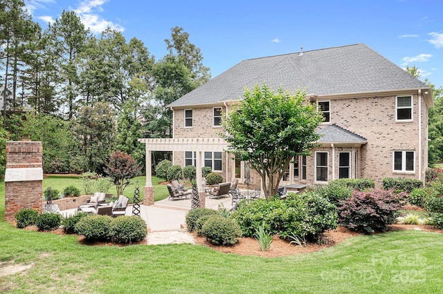 3204 Mcpherson St, Waxhaw, NC 28173 - back of property featuring a lawn, outdoor lounge area, a patio area, and brick siding