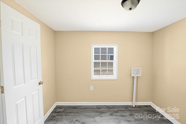 3209 Lowell Rd, Lowell, NC 28054 - empty room featuring dark wood-style floors and baseboards