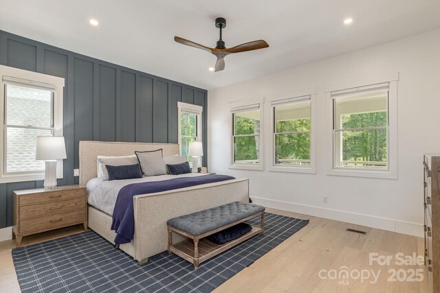 40 Hidden Pond Ln, Brevard, NC 28712 - bedroom featuring wood finished floors, recessed lighting, baseboards, a ceiling fan, and a decorative wall