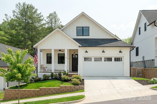 40 Hidden Pond Ln, Brevard, NC 28712 - modern farmhouse style home with roof with shingles, board and batten siding, a porch, concrete driveway, and a front yard