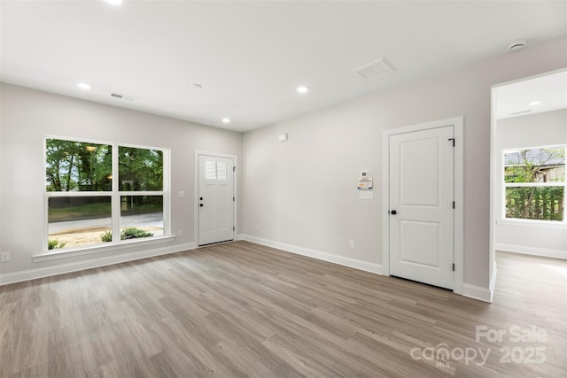 105 Spring Garden Dr, Gastonia, NC 28052 - unfurnished living room featuring wood finished floors, baseboards, and recessed lighting