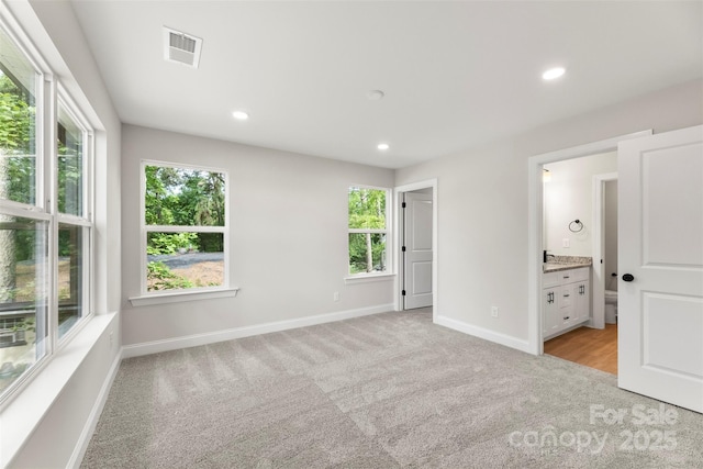 105 Spring Garden Dr, Gastonia, NC 28052 - unfurnished bedroom featuring light colored carpet, baseboards, recessed lighting, and connected bathroom