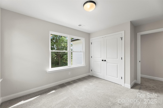 105 Spring Garden Dr, Gastonia, NC 28052 - unfurnished bedroom featuring carpet floors, baseboards, and a closet
