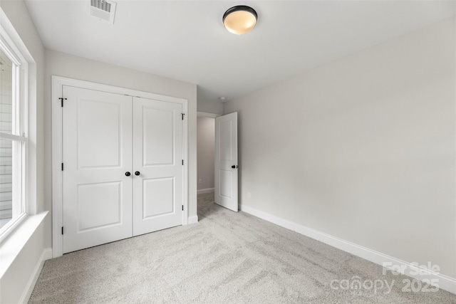 105 Spring Garden Dr, Gastonia, NC 28052 - unfurnished bedroom with carpet flooring, a closet, and baseboards