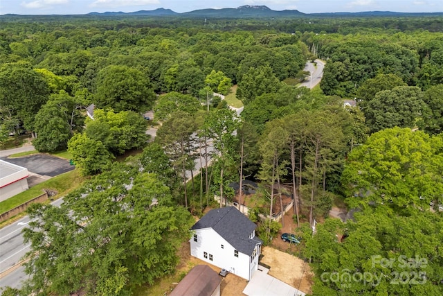 105 Spring Garden Dr, Gastonia, NC 28052 - aerial view of a heavily wooded area and a mountainous background
