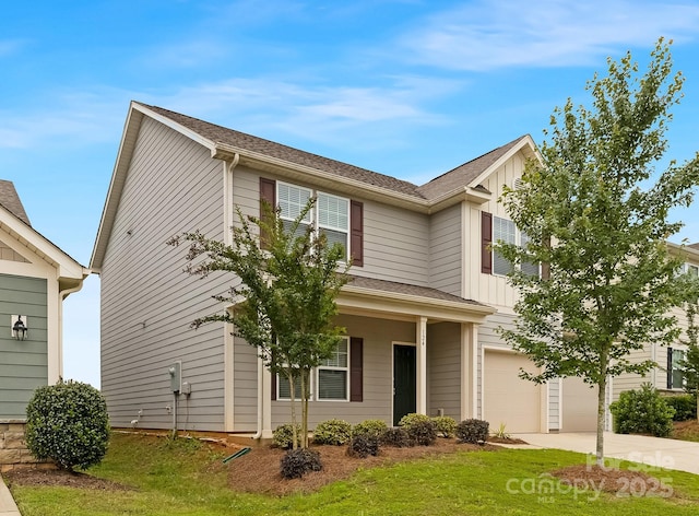 124 Canada Dr Unit 45, Statesville, NC 28166 - view of front of home with a garage, concrete driveway, board and batten siding, and a front lawn