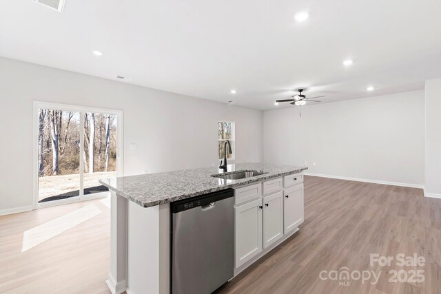 3323 Burberry Dr, Gastonia, NC 28052 - kitchen featuring stainless steel dishwasher, a sink, ceiling fan, a center island with sink, and light wood-style floors
