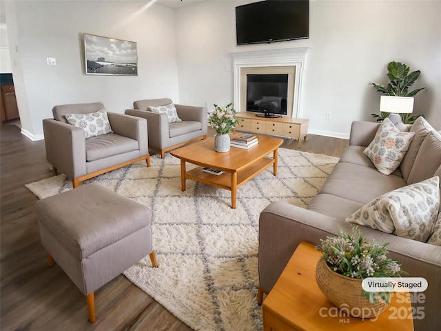204 W Boyd St, Maiden, NC 28650 - living room with wood finished floors, baseboards, and a glass covered fireplace
