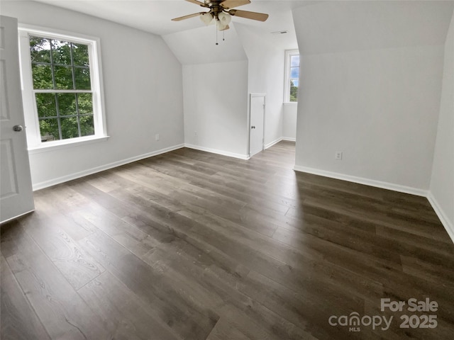 204 W Boyd St, Maiden, NC 28650 - additional living space featuring vaulted ceiling, ceiling fan, dark wood-type flooring, and baseboards