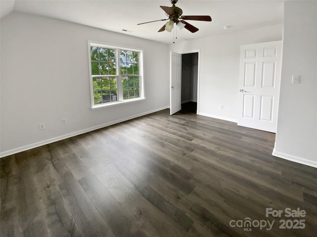 204 W Boyd St, Maiden, NC 28650 - unfurnished bedroom with dark wood-style floors, baseboards, and a ceiling fan