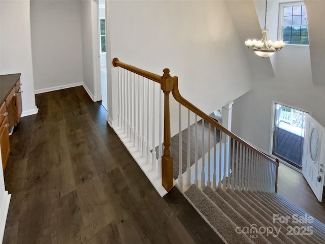 204 W Boyd St, Maiden, NC 28650 - staircase with a chandelier, wood finished floors, and baseboards