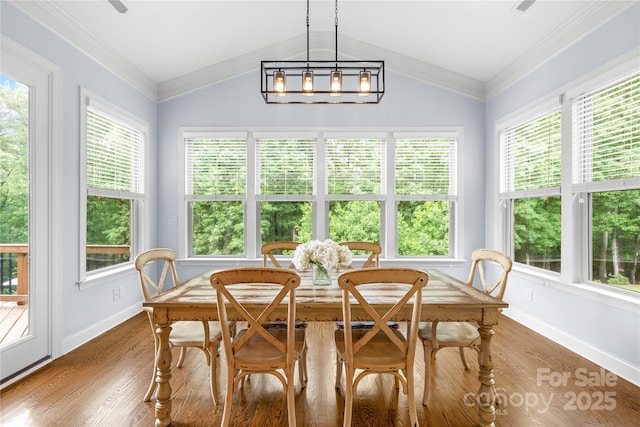 2289 Pine Valley Dr, Denver, NC 28037 - dining space featuring baseboards, plenty of natural light, wood finished floors, and lofted ceiling