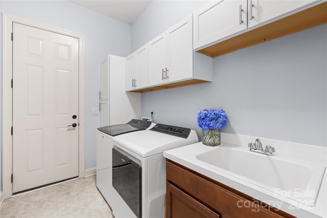 2289 Pine Valley Dr, Denver, NC 28037 - laundry room with washing machine and clothes dryer, cabinet space, and light tile patterned floors