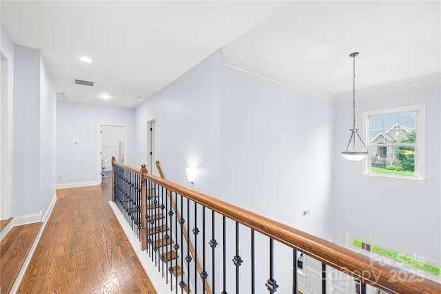 2289 Pine Valley Dr, Denver, NC 28037 - hallway featuring an upstairs landing, wood finished floors, baseboards, recessed lighting, and crown molding
