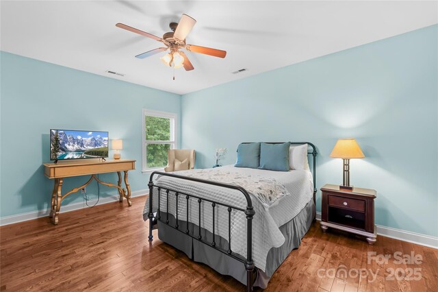 2289 Pine Valley Dr, Denver, NC 28037 - bedroom with wood finished floors, baseboards, and a ceiling fan