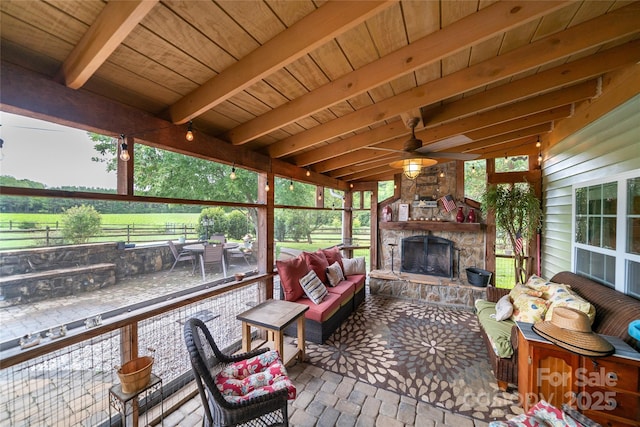 2310 Gill Jordan Rd, Chester, SC 29706 - sunroom with an outdoor living space with a fireplace, a ceiling fan, and beam ceiling