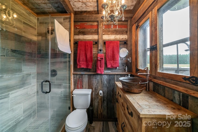 2310 Gill Jordan Rd, Chester, SC 29706 - bathroom with vanity, a stall shower, a chandelier, wooden ceiling, and wood walls