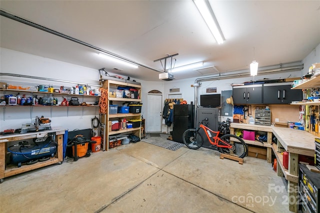 2310 Gill Jordan Rd, Chester, SC 29706 - garage with a workshop area and a garage door opener