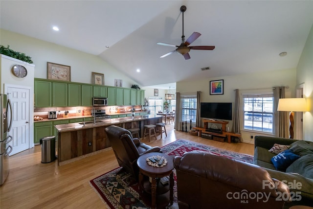 2310 Gill Jordan Rd, Chester, SC 29706 - living room featuring ceiling fan, light wood finished floors, high vaulted ceiling, and recessed lighting