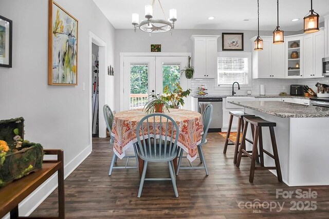 5016 Old Pine Ln, Cherryville, NC 28021 - dining area with a chandelier, dark wood-style flooring, recessed lighting, french doors, and baseboards
