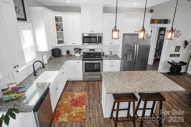 5016 Old Pine Ln, Cherryville, NC 28021 - kitchen featuring stainless steel appliances, light stone counters, tasteful backsplash, white cabinets, and recessed lighting