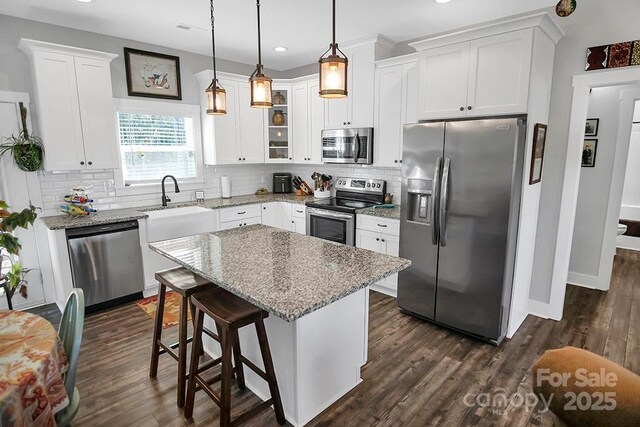 5016 Old Pine Ln, Cherryville, NC 28021 - kitchen featuring appliances with stainless steel finishes, recessed lighting, white cabinets, backsplash, and dark wood-type flooring