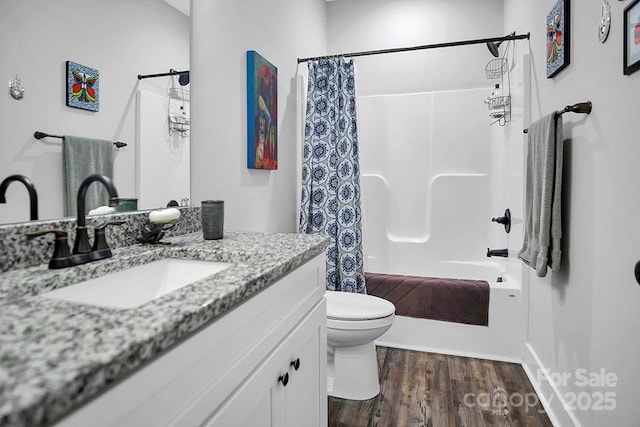 5016 Old Pine Ln, Cherryville, NC 28021 - full bathroom featuring vanity, toilet, shower / bath combo with shower curtain, and wood finished floors