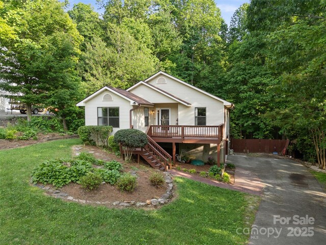 100 Tarragon Pl, Flat Rock, NC 28731 - view of front of house with a wooden deck, stairway, and asphalt driveway