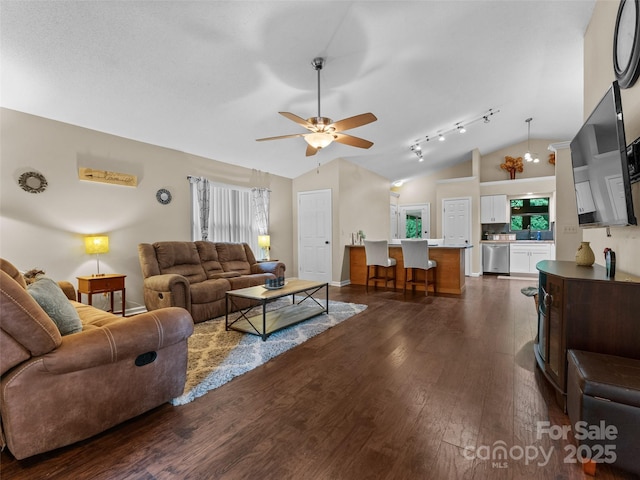 100 Tarragon Pl, Flat Rock, NC 28731 - living area featuring vaulted ceiling, dark wood-style flooring, ceiling fan, track lighting, and baseboards