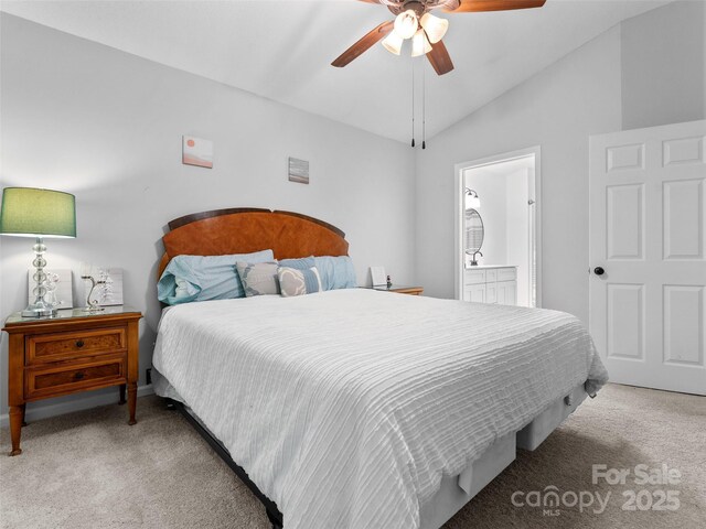 100 Tarragon Pl, Flat Rock, NC 28731 - bedroom featuring carpet flooring, vaulted ceiling, ensuite bathroom, and ceiling fan